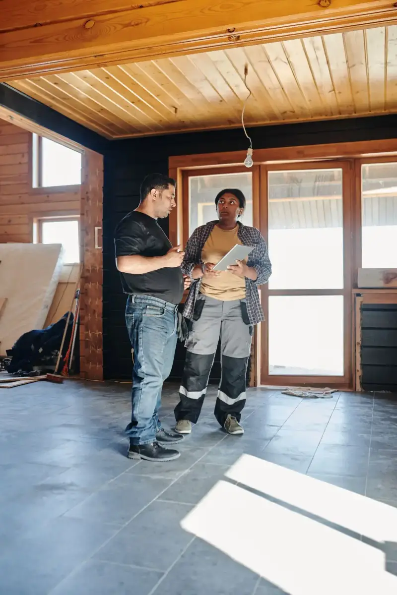 A contractor discussing project details with a homeowner